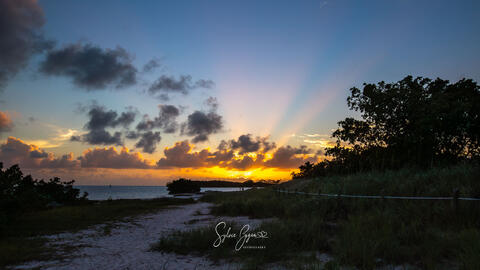 sun beams or sun rays in morning between the clouds