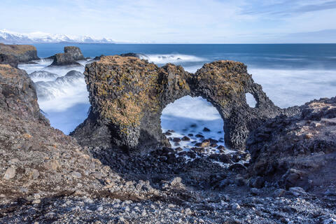 rock arch formation on the ocean coastline