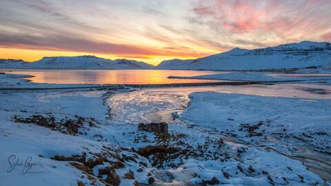 sunrise over an icy landscape