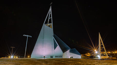 an illuminated church exterior at night