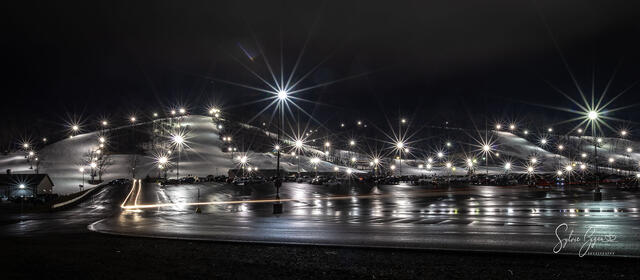Panoramic view of glittering Lights at a ski area at night